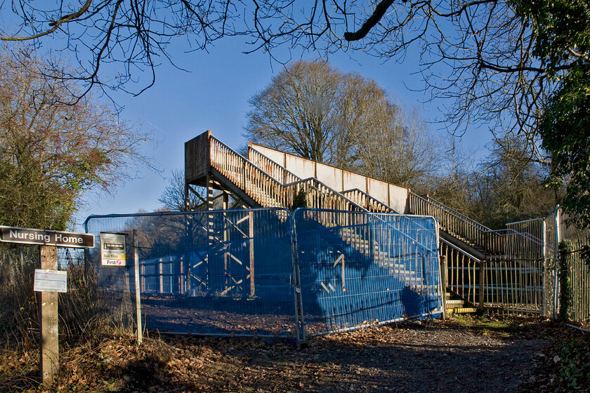 Middlehill Footbridge, 102 miles, 46 chains from London Paddington, just prior to demolition (For GWML electrification) ST805680 
 At just over one hundred and two miles from London Paddington Middlehill footbridge is seen just a week or so prior to its demolition and replacement. The footbridge has stood at this spot for many years but does not provide sufficient clearance for the forthcoming electrification of the route. I suspect that the replacement will be one of Network Rail's ridiculously over-engineered green structures that they seem so keen on.

NB The demolition was a complete waste of time and resources as was much other work as the electrification west of Thingley Junction (Chippenham) was to be cancelled by government dictate in November 2016 
 Keywords: Middlehill Footbridge 102 miles 46 chains from London Paddington prior to demolition GWML electrification ST805680