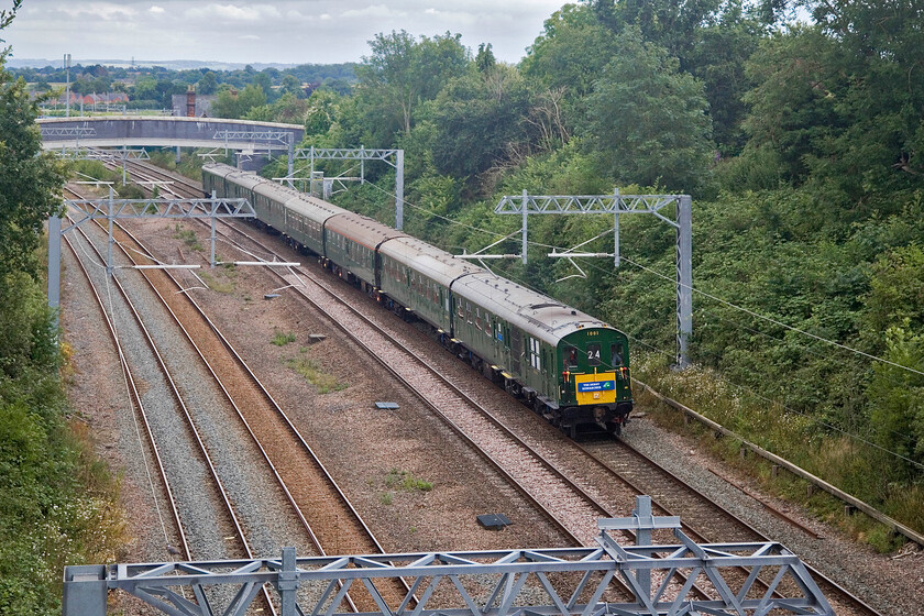 1001, outward leg of The Derby Researcher, 07.02 Hastings-Derby (1Z24,3L), Highfield bridge, Oakley 
 Within a few minutes of arriving at my chosen location in the Bedfordshire village of Oakley The Derby Researcher charter passed worked by Hastings Diesels Limited DEMU set 1001. Leading the set is DMBS 60118 'Tunbridge Wells' which was in charge all the way from Hastings to Derby running as 1Z24. It was nice to see that the charter was put on the fast line from Bedford and as a consequence, it was working hard 'Thumping' nicely as it passed me. Incidentally, if you wish to visit this spot you will need a tall ladder to take photographs from as NR installed absolutely huge parapet extensions when the line was electrified. 
 Keywords: 1001 The Derby Researcher 07.02 Hastings-Derby 1Z24 Highfield bridge, Oakley Tunbridge Wells DEMU.jpg