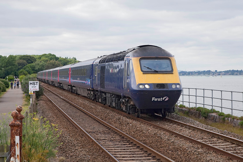 43070, GW 15.06 London Paddington-Penzance (1C86, 19L), Starcross station 
 43070 'The Corps of Royal Electrical and Mechanical Engineers' leads the 1C86 15.06 Paddington to Penzance along the side of the Exe Estuary at Stracross station. When I was lad aged 15, I camped for a night at Starcross at the far end of the promenade in this picture just before the trees when undertaking a tour of the West of England mainline by bike. A two-part article about this epic trip appeared in Traction Magazine. 
 Keywords: 43070 1C86 Starcross station