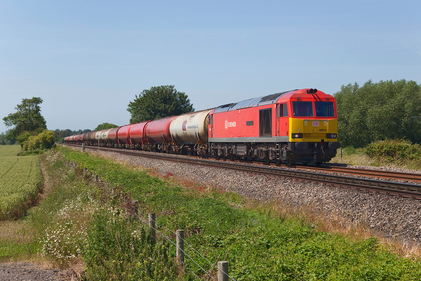 60019, 05.00 Robeston-Westerleigh (6B13), Over SO809192 
 This was the working that I 'pulled over at Over' near to Gloucester to see! It was running extremely late by this point but it was worth the wait. 60019 'Port of Grimsby & Immingham' approaches Gloucester at Over working the regular 05.00 Robeston to Westerleigh oil tankers train running as 6B13. This takes long route up one side of the River Severn though Lydney then back down the other side in order to access its destination that is right next to the M4 motorway just north of Bristol on the old Midland line. 
 Keywords: 60019 05.00 Robeston-Westerleigh 6B13 Over SO809192