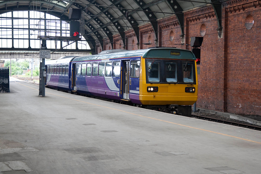 142020, NT 11.25 Bishop Auckland-Saltburn (2D30), Darlington station 
 The final leg of my journey to Eaglescliffe was taken on one of Northern's finest! 142020 arives into Darlington station working the 11.25 Bishops Auckland to Saltburn. I 'nodded' in this unit the relatively short distance to my destination. 
 Keywords: 142020 11.25 Bishop Auckland-Saltburn 2D30 Darlington station