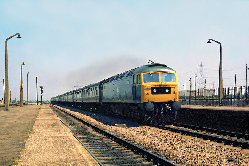 47143, unidentified down working, Severn Tunnel Junction station 
 47143 leads a uniform rake of Mk.1 stock through Severn Tunnel Junction station heading west. I have no identification on this working but a contemporary gen had it working a Paignton to Manchester train as far as an 'unknown' station. Maybe it worked to New Street or Gloucester and then headed west again on an inter-regional working as shown here?