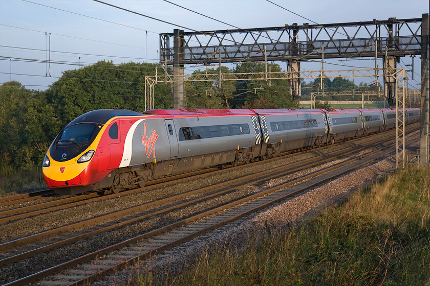 390154, VT 05.33 Preston-London Euston (1R07), Roade Hill 
 Named just eight weeks ago at Euston by the Duke of Cambridge 390154 'Matthew Flinders' passes the chilly Northamptonshire countryside working the 1R07 05.33 Preston to Euston train. 
 Keywords: 390154 05.33 Preston-London Euston 1R07 Roade Hill Virgin Pendolino Matthew Flinders.