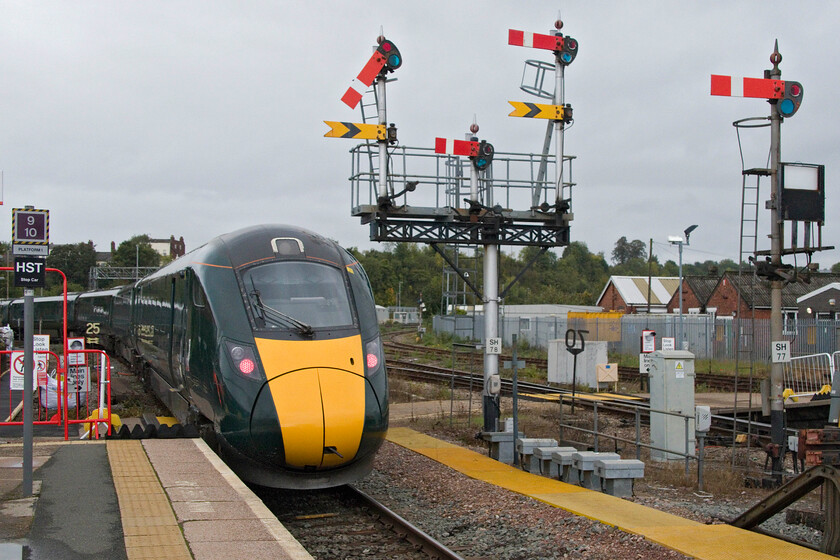 800318, GW 11.52 London Paddington-Hereford (1W02, 13L), Worcester SH station 
 GWR IET 800318 leaves Worcester Shrub Hill station working the 1W02 11.52 Paddington to Hereford service. It is passing the superb three-way splitting bracket signal controlling departures from the down platform. I find it incredible that whilst on the East Coast route is testing and trialling European Rail Traffic Management System (ERTMS) signalling here in Worcestershire trains are still being controlled by Victorian infrastructure! 
 Keywords: 800318 11.52 London Paddington-Hereford 1W02 Worcester SH station GWR IET