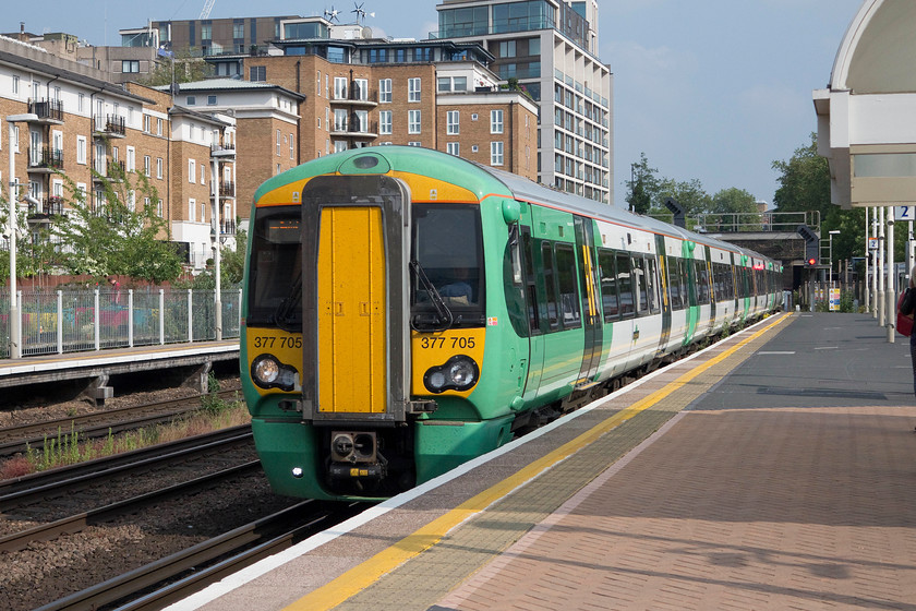 377705, SN 16.10 East Croydon-Milton Keynes Central (2M47), Kensington Olympia station 
 Our train home from London to Milton Keynes arrives into Kensington Olympia station. 377705 is working the 2M47 16.10 East Croydon to Milton Keynes. 
 Keywords: 377705 16.10 East Croydon-Milton Keynes Central 2M47 Kensington Olympia station