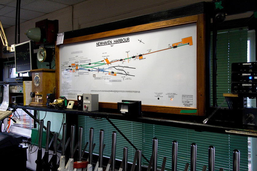 Track diagram, Newhaven Harbour signal box 
 We were afforded access to Newhaven Harbour signal box by the signalman. Apparently, with just less than three weeks of operation remaining, we were two of many visitors to observe its operations during the twilight of it's life. In this image, the track diagram can be seen stretching from Harbour station all the way to Seaford. The remaining stub of the Newhaven Marine line can also be seen. 
 Keywords: Track diagram Newhaven Harbour signal box