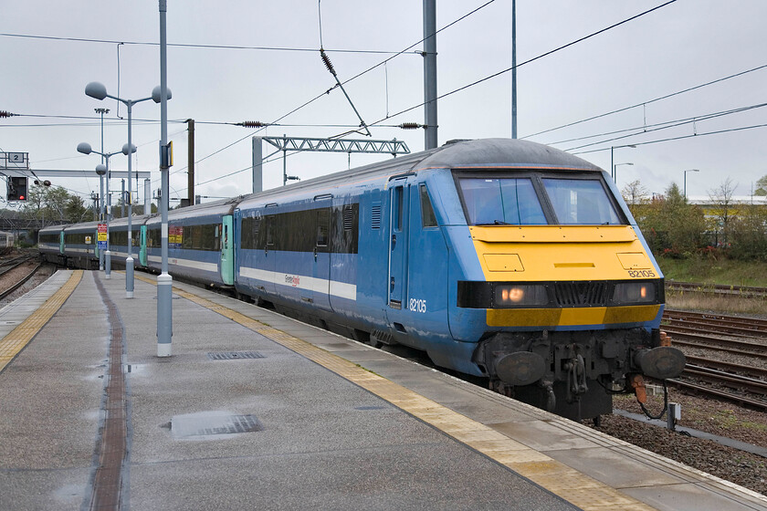 82105, LE 09.00 London Liverpool Street-Norwich, Norwich station 
 On a miserable morning at Norwich station, DVT 82105 leads the 09.00 in from Liverpool Street. I can't help but feel that the National Express Greater Anglia livery worn by the GEML trains is a little dull, especially on such a grey day as this! 
 Keywords: 82105 09.00 London Liverpool Street-Norwich Norwich station