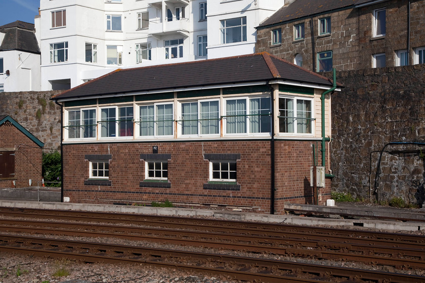 Penzance signal box (GW, 1938) 
 Penzance signal box stands just east of the station facing the glorious Mounts Bay; what a place to be a signalman! This is the second box at Penzance, this one, a 1938 GWR Type 12B replaced an earlier structure. In recent years it has undergone a full refurbishment in some part to make it a little more weather-proof. In winter, when a storm is blowing in off the Atlantic, it would somewhat different to a mid summer's day as shown here! 
 Keywords: Penzance signal box GW 1938