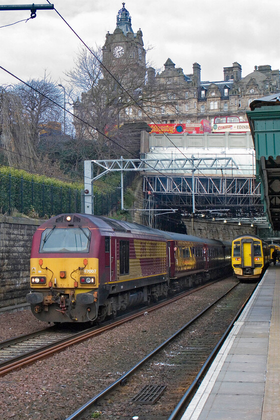 67007, SR 17.08 Edinburgh Waverley-Edinburgh Waverley (2G13) & 158867, SR 16.47 Newcraighall-Kirkcaldy, Edinburgh Waverley station 
 The return of locomotive-hauled peak-time services in the Edinburgh area has proved popular if only for enthusiasts! Utilising a set of Mk. II air-conditioned stock the trains are hauled by, for the moment, Class 67s hired in from DB Cargo UK (formally EWS). 67007 leaves Waverley with the 2G13 return 17.08 service that will complete the Fife Circle route returning to Waverley later in the early evening. As the Class 67 hauled service leaves 158867 pauses working the 16.47 Newcraighall to Kirkcaldy service. 
 Keywords: 67007 16.08 Edinburgh Waverley-Edinburgh Waverley 2G13 158867 16.47 Newcraighall-Kirkcaldy Edinburgh Waverley station ScotRail EWS