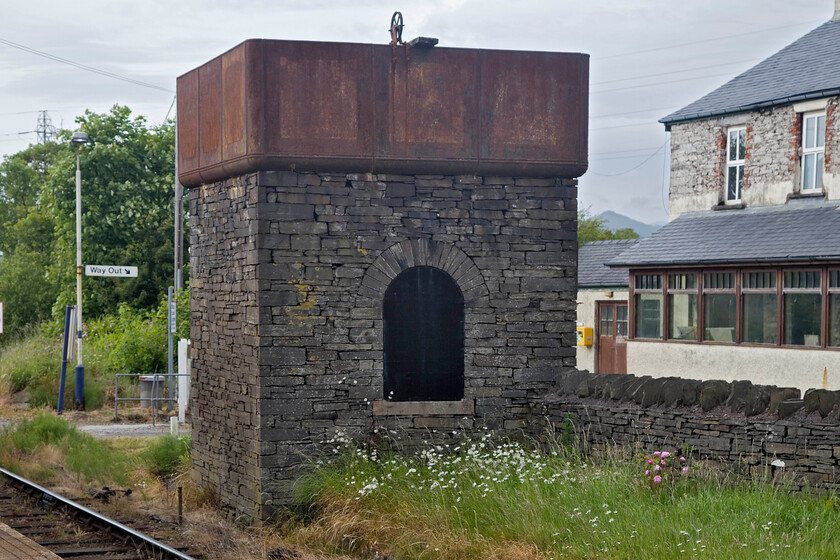 Former water tower, Foxfield station 
 Adopting its typical belt and braces approach to the construction of its assets the old water tower at Foxfield still stands and looks as if it is ready to fill the tender of a passing steam train at the drop of a hat! Unlike the stone-built water tower seen earlier in the day at Sellafield, this one is constructed of slate that was probably mined nearby at Consiton to where a branch line once went from Foxfield. 
 Keywords: Former water tower Foxfield station