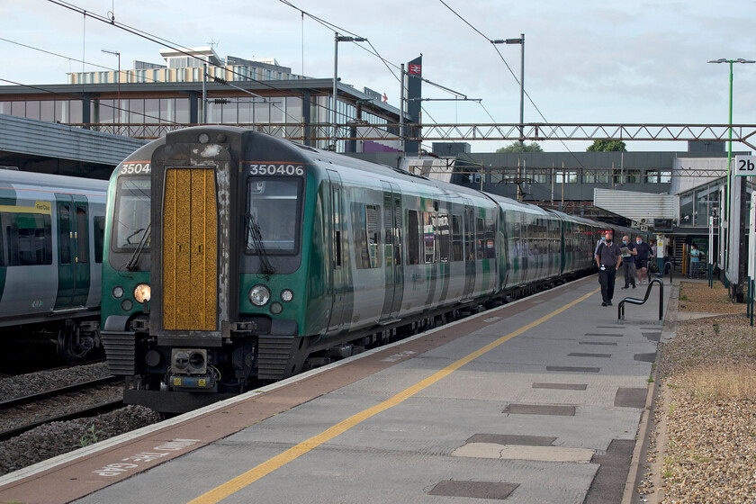 350406, LN 05.34 London Euston-Birmingham New Street (2Y34, 1L), Northampton station 
 The first train of our journey to Carlisle drifts into Northampton station. Andy and I travelled on 350406 as far as Rugby working the 05.34 Euston to Birmingham service. It was unfortunate that we only travelled as far as Rugby on this particular unit as the ten former TPE units have a far better ambience inside the carriages with better seats and they seem roomier to me? 
 Keywords: 350406 05.34 London Euston-Birmingham New Street 2Y34 Northampton station London NorthWestern Desiro