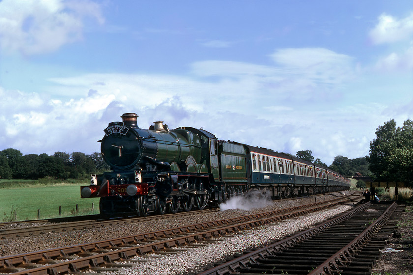 5051, outward leg of The John Mynors Memorial, London Paddington-Bridgnorth (SVR), Hatton Bank SP226663 
 A dramatic photograph of 5051 Drysllwyn Castle as it approaches the summit of Hatton bank just near the station of the same name. The locomotive is proudly wearing the headboard commemorating John Mynors who bought Drysllwyn Castle from Barry (along with four other GWR locomotives) and financed its return to steam. He died suddenly at the age of fifty-seven on 31.03.79. According to a locomotive performance log that I have discovered on the internet, at this point on Hatton bank 5051 was doing a creditable forty-three miles per hour. However, that particular log erroneously has 5051 as 'Earl Bathurst' but on this day Didcot turned it out with its original Drysllwyn Castle plates as carried for just one year from new in 1936. 
 Keywords: 5051 The John Mynors Memorial, London Paddington-Bridgnorth SVR Hatton Bank SP226663