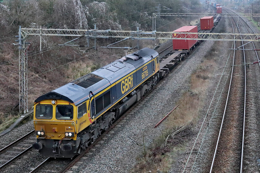 66705, 09.07 Ditton-Felixstowe South (4L05, 31E), Victoria bridge 
 Sweeping around the curve having just passed Roade on the up fast line 66705 'Golden Jubilee' leads the 4L05 09.07 Ditton to Felixstowe GBRf service. Having not seen the sun for what seemed like days now this was yet another grey and dull January day. 
 Keywords: 66705 09.07 Ditton-Felixstowe South 4L05 Victoria bridge GBRf Golden Jubilee