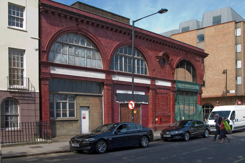 Former Euston underground station, Melton Street 
 On the corner of Melton Street and Drummond Street, on the western side of Euston mainline station, sits one of Leslie Greens classically designed red brick and distinctive former underground stations. It was opened in 1907 by the Charing Cross, Euston and Hampstead Railway (better known as the Hampstead Tube) and was one of two original underground lines serving Euston mainline station. The line started at Charing Cross going to Golders Green and Highgate. When the line was combined with the City and South London Railway which ran from the City through to Stockwell and Euston they were joined by an extensive network of pedestrian tunnels under Euston station. However, during the extensive re-building of Euston station in the 1960s London Underground took the opportunity to rationalise their network too and to develop the Northern Line station. This part of the underground station was closed on 29th April 1962. Inside it remains a time-capsule with period posters and the like that can be enjoyed as part of London Transport Museum's Hidden London tours. 
 Keywords: Former Euston underground station, Melton Street