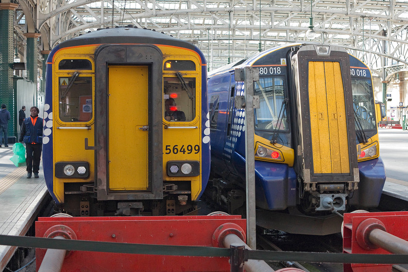 156499, SR 06.46 Newcastle-Glasgow Central (1S50) & 380018, SR 10.36 Glasgow Central-Gourock (2G71), Glasgow Central station 
 Old and new adjacent to each other at Glasgow Central station. To the left is 156499, built in the late 1980s and to the right is 380018 that was introduced in 2010. The class 156 has arrived with the 06.46 from Newcastle whilst the class 380 is about to leave with the 2G71 10.36 to Gourock. 
 Keywords: 156499 06.46 Newcastle-Glasgow Central 1S50 380018 10.36 Glasgow Central-Gourock 2G71 Glasgow Central station