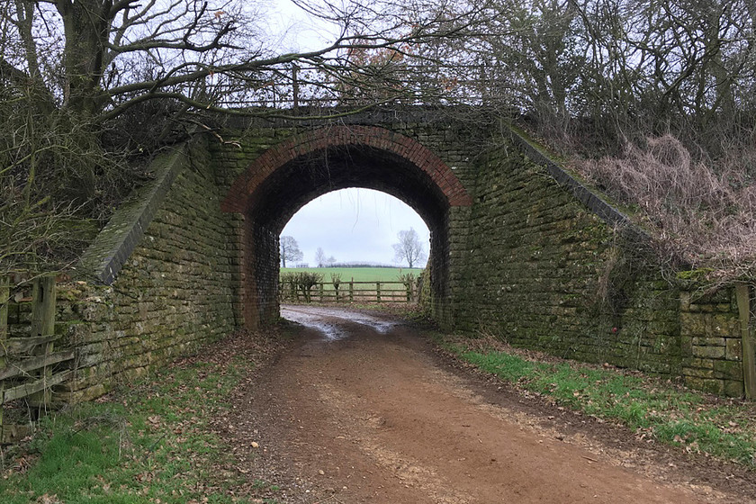 Former SMJR bridge, Easton Neston SP714502 
 Despite not having carried any rail traffic for nearly sixty years, the bridge that carried the SMJ Railway over this farm track looks to be in remarkable condition. This location is near to the village of Hulcote on land managed by the Easton Neston Estate. 
 Keywords: Former SMJR bridge, Easton Neston SP714502 Stratford-upon-Avon and Midland Junction Railway