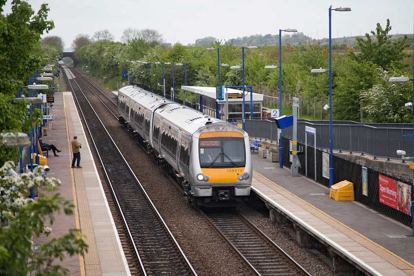 168214, CR 10.41 Oxford-London Marylebone (1Y30, RT), Haddenham & Thame Parkway station 
 Andy watches 168214 arrive into Haddenham and Thame Parkway station from platform one. It was working the 10.41 Oxford to London Marylebone that travelled via the recently reopened Oxford to Bicester line. 
 Keywords: 168214 1Y30 Haddenham & Thame Parkway station