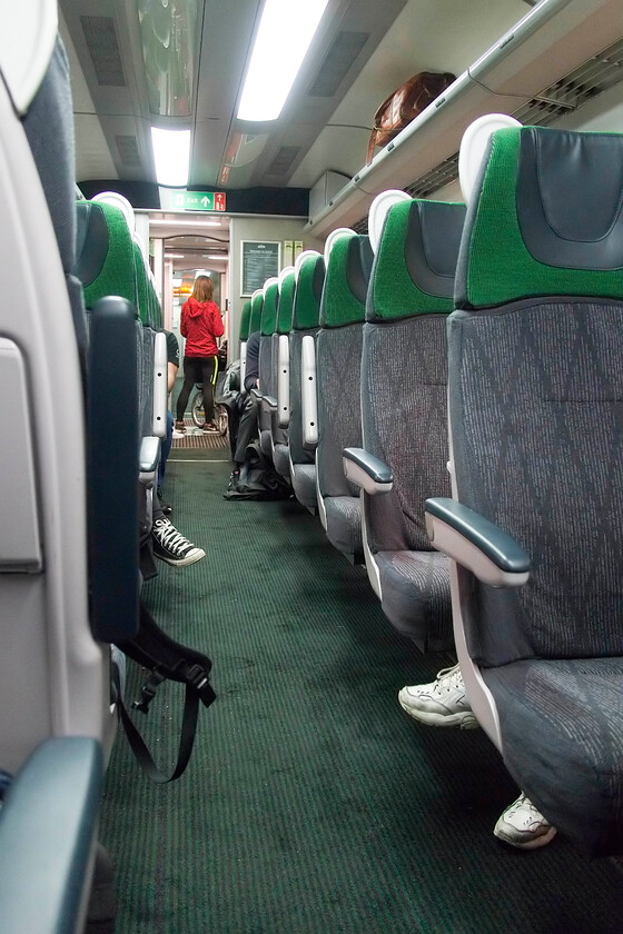 Interior, 14.00 Cardiff Central-Penzance (2C79, 30L), Bristol Temple Meads station 
 The smart and coordinated interior of one of the refurbished Mk. III coaches that form part of the Castle sets operating between Cardiff and Penzance via Bristol and Exeter. Whilst the seats are predominantly airline style there are some tables for four and most seats are window aligned. The spacing of the seating was good and all had access to a thirteen-amp and USB sockets. The lighting was terrific and the general fit and finish were excellent. It seems such a shame then that GWR has announced that the Castle sets are to be withdrawn at the end of the year to be replaced with the far inferior IET 800s; a retrograde step for the travelling public of the West of England if ever I have seen one. 
 Keywords: Interior 14.00 Cardiff Central-Penzance 2C79 Bristol Temple Meads station GWR HST Castle set