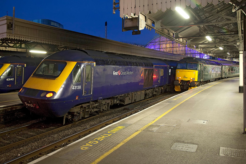 43142, GW 23.30 London Paddington-Cardiff Central (1C36, 9L), 43138, GW 22.45 London Paddington-Swansea (1B94, 1E) & 57 602, GW 23.45 London Paddington-Penzance Sleeper (1C99, 2E), London Paddington station 
 The last few down trains from Paddington wait to depart on a glorious summer's night. 43142 'Reading Panel Signal Box 1965-2010' waits next to 43138. They are going to Cardiff (1C36) and Swansea (1B94) respectively. At platform one is Andy's and my train west, the 23.45 to Penance, the Night Rivera Sleeper. We were looking forward to a good night's sleep in our adjoining first class cabins and waking up in Cornwall! 
 Keywords: 43142 1C36 43138 1B94 57 602 23.45 London Paddington-Penzance Sleeper 1C99 London Paddington station