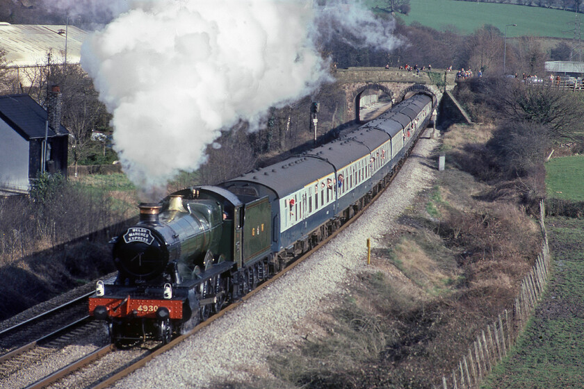 4930, return leg of The Welsh Marches Express, 15.35 Newport-Shrewsbury, Caerleon ST330923 
 In quite a contrast to photographs taken earlier in the day 4930 'Hagley Hall' makes a fine sight in the early spring sunshine as it heads north with the returning Welsh Marches Express charter. The train had left Newport a little earlier at 15.35 and was heading back to Crewe with the steam coming off at Hereford in favour of a diesel for the remaining eighty four miles. It is seen passing the small village of Ponthir near Caerleon. The milepost will be indicating thirty-eight miles to Hereford. 
 Keywords: 4930 The Welsh Marches Express, 15.35 Newport-Shrewsbury Caerleon ST330923 Hagley hall