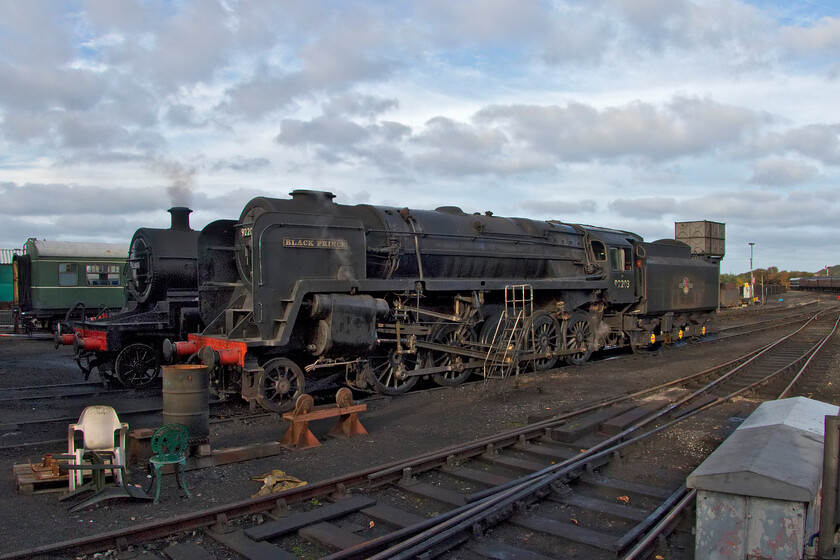 53809 & 92203, stabled, Weybourne Yard 
 Looking at the general condition of 92203 'Black Prince' reminds one of the terrible state that British Railways let their steam fleet get into in their final years of operation up to August 1968. I also wonder what its previous owner, the artist the late David Shepherd would think if he could see it looking like this! Since its last overhaul in 2014 92203 has worked exclusively on the North Norfolk Railway which acquired it from Shepherd in 2015 two years before his death. At the time that this photograph was taken on 19th October 2022, Black Prince had failed earlier in the day and was to undergo repairs the following day. 
 Keywords: 53809 92203 stabled Weybourne Yard 9F Black Prince