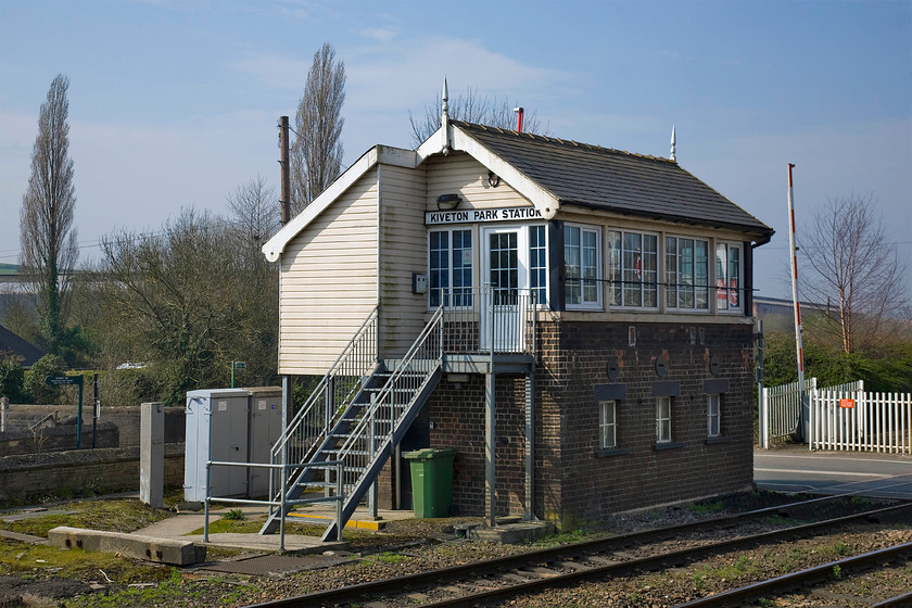 Kiverton Park Station signal box (GC, date unknown) 
 The superb Kiverton Park Station signal box is seen complete with a lovely pair of finials atop the slate roof. The box is in good condition but is a little marred by some uPVC cladding and windows along with some galvanized replacement steps. The toilet is also a more recent addition. The box is a Great Central type 5 structure that I believe may date from 1880 but I stand to be corrected. It no longer operates any semaphores having an IFS panel that controls the level crossing. 
 Keywords: Kiverton Park Station signal box