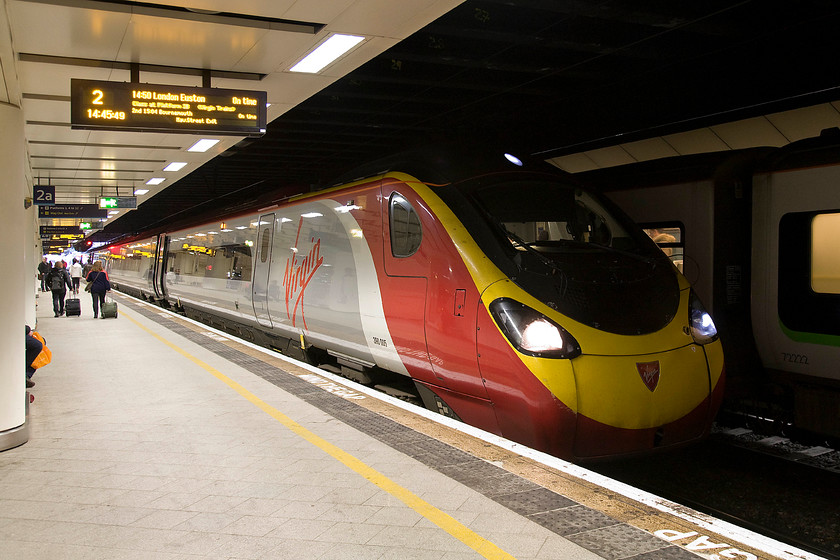 390005, VT 14.50 Birmingham New Street-London Euston (1B27), Birmingham New Street station 
 Five minutes prior to departure, 390005 'City of Wolverhampton' waits in the gloom of Birmingham New Street to depart with the 14.50 to Euston. This 112 mile journey takes about an hour and a quarter, a time that will be cut to about 45 minutes when (if?) HS2 is completed. 
 Keywords: 390005 14.50 Birmingham New Street-London Euston 1B27 Birmingham New Street station