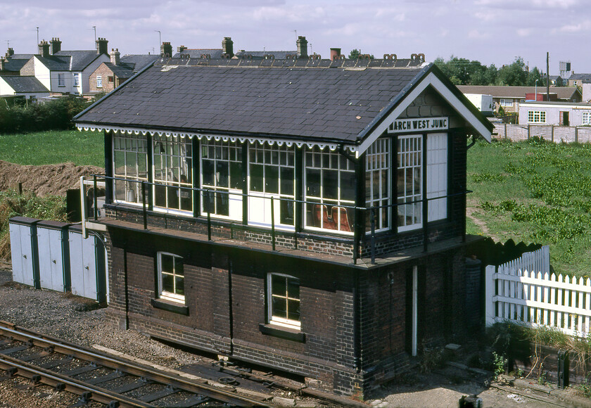 March West Junction signal box (GE, c.1885) 
 March West Junction signal box was a Great Eastern Type 4 structure dating from around 1885. It is seen here photographed from a footbridge that spans the line in the Norwoodside area of the Cambridgeshire town. It controlled access to the vast March Yard from the west but was deemed surplus to requirements as the importance of the yard declined with the box being closed on 29.11.87. The box wears its wooden nameboard and still has the decorative edging to the fascias with this particular bargeboard pattern being unique to this design as far as the GER was concerned at least. As an aside, whilst working on the image in Photoshop, I was examining the details and spotted what appears to be a former DMU double seat against the window in the bottom right complete with the little chrome ashtray still attached to the seat back. Today the view from the same rickety footbridge is somewhat different as recorded during a 2023 visit, see..... https://www.ontheupfast.com/p/21936chg/30041446450/x170620-06-24-bristol-temple-meads 
 Keywords: March West Junction signal box