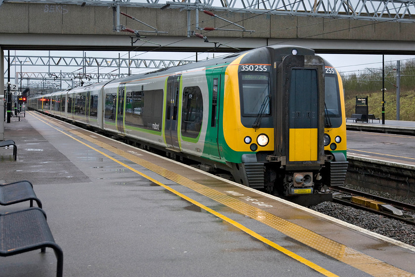 350255, 350238 & 350254, LM 08.24 Euston-MKC (2K21), Milton Keynes station 
 Having worked up earlier in the morning as a packed commuter service London Midland's 350255, 350238 and 350254 return north as the 08.24 Euston to Milton Keynes Central. As can be seen, it a particularly grey and grisly morning not out of keeping with late February I suppose! 
 Keywords: 350255 350238 350254 08.24 Euston-MKC 2K21 Milton Keynes station