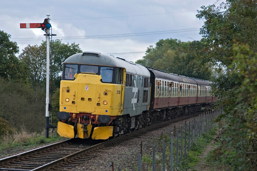 31108, 12.50 Peterborough Nene Valley-Wansford (2M48), Wansford TL097081 
 31108 looks superb in its retro. BR Railfreight large logo livery as it approaches Wansford. It is leading the 12.50 Peterborough Nene Valley to Wansford gala service that was, judging by the window leaning going on, a popular working! 
 Keywords: 31108 12.50 Peterborough Nene Valley-Wansford 2M48 Wansford TL097081 Brush Type 2