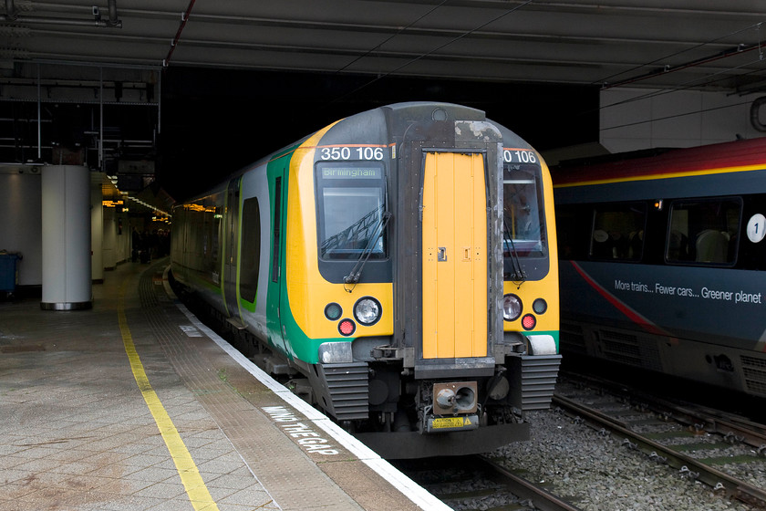 350106, LM 10.28 London Euston-Birmingham New Street (2Y07), Birmingham New Street station 
 Having arrived with the 2Y07 'slow' 10.28 Euston to Birmingham New Street, 350106 rests at its destination. Notice the ironic message from Virgin Trains on the side of diesel powered 221115 'Polmadie Depot' that is about to travel over 100 miles under energised 25kV wires all the way to preston! 
 Keywords: 350106 10.28 London Euston-Birmingham New Street 2Y07 Birmingham New Street station. Notice the ironic message from Virgin Trains on the side of diesel powered 221115 'Polmadie Depot' that is bout to travel over 100 miles under energised 25kV wires all the way to preston!