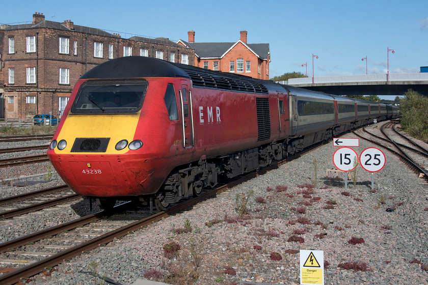 43238, EM 10.29 Sheffield-London St. Pancras (1C35, 3L), Derby station 
 Looking decidedly tatty, not surprising really, 43238 arrives at Derby leading the 1C35 10.29 Sheffield to St. Pancras service. This former LNER power car still wearing the bright Virgin East Coast livery is in its final months of service prior to the introduction of new stock once the electrification between Bedford, Kettering and Corby is completed. Andy and I were not ready for this train to be an HST as it was scheduled to be a Meridian so obviously something had gone wrong in the train planning office earlier. 
 Keywords: 43238 10.29 Sheffield-London St. Pancras 1C35 Derby station HST Virgin East Coast LNER EMR East Midlands Railway