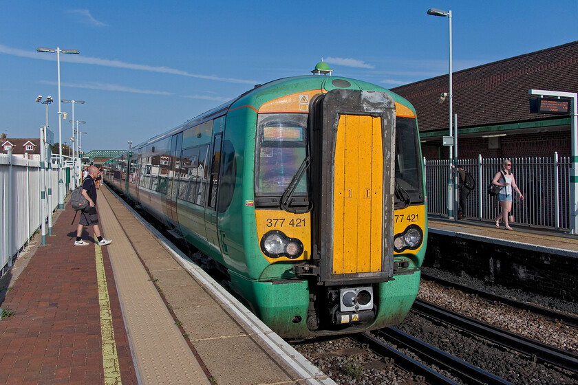 377421, SN 15.28 Southampton-Brighton (1N27, 6L), Lancing station 
 The return train of my short late afternoon visit to Lancing has just come to a halt at Lancing station. I travelled aboard the ex 15.28 Southampton Central back to Brighton worked by Southern's 377421. Sitting waiting for this train on Lancing station in the glorious hot sunshine (another day with a recorded temperature in excess of thirty degrees Celsius) felt more akin to June than September! 
 Keywords: 377421 15.28 Southampton-Brighton 1N27 Lancing station