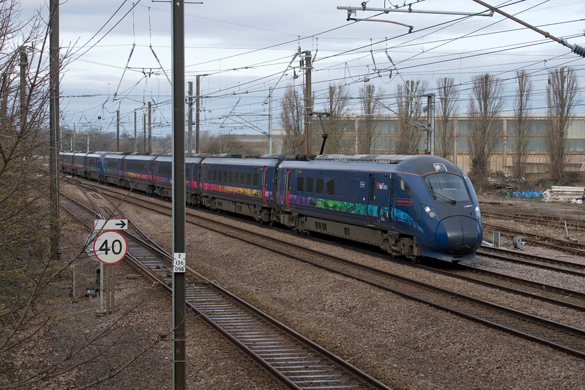 802302 & 802301, HT 08.24 Hull-London King's Cross (1A92, 2E), Tallington 
 802302 'Jean Bishop-The Bee Lady' and 803301 'Amy Johnson' work the 1A92 08.24 Hull to King's Cross service past Tallington in Lincolnshire. The large building in the background is part of the Dowmac concrete plant discussed a little earlier in this sequence of photographs. 
 Keywords: 802302 802301 08.24 Hull-London King's Cross 1A92 Tallington Hull Trains Paragon Jean Bishop-The Bee Lady Amy Johnson