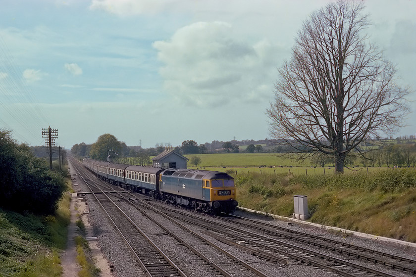 47463 (not 47460!), 13.20 Weymouth-Bristol Temple Meads, Fairwood Junction 
 The 13.20 Weymouth to Bristol Temple Meads passes over Fairwood Junction as it takes the line into the station with 47463 leading the rake of Mk. I stock. Note that the redundant headcode panel has been set to confuse us spotters by indicating that it is 47460. Today, this service would be formed of a unit of possibly three carriages, not quite the nine as seen on this service; how things have changed! The huge but totally dead elm tree to the right, a victim of Dutch elm disease dominates this view. Over forty years later in 2021, this scene is essentially the same but for the loss of the dead elm tree and the mechanical signalling. Of course, the trains are a little different too, see....... https://www.ontheupfast.com/p/21936chg/30014529096/x3-802114-gw-14-12-paignton-london 
 Keywords: 47463 not 47460 13.20 Weymouth-Bristol Temple Meads Fairwood Junction