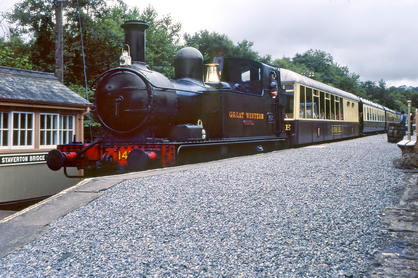 1450, 15.30 Buckfastleigh-Totnes Riverside, Staverton Bridge station 
 The Dart Valley Railway's 15.30 Buckfastleigh to Totnes Riverside service pauses at Staverton Bridge. It is being led by preserved Collett 1450 that was a regular performer on the line for many years. It is hauling a smark rake of stock including a 'Devon Belle' observation car marshalled behind the locomotive. After spending many years on the SDR 1450 moved to the Dean Forest Railway where it spent ten years. Then it moved to the Severn Valley Railway where it remains today as a member of their home fleet seeing regular use.

There is an audio recording of this event on my youtube channel, see...https://youtu.be/o8RoG6aePTU 
 Keywords: 1450 15.30 Buckfastleigh-Totnes Riverside Staverton Bridge station Collett 4800 Class