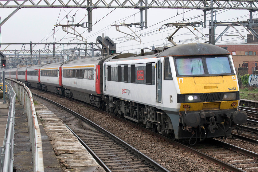 90005, LE 11.30 Norwich-London Liverpool Street (1P33, 1L), Bethnal Green station 
 90005 'Vice-Admiral Lord Nelson' passes Bethnal Green leading the 11.30 Norwich to Liverpool Street station. Very soon, these locomotives and the Mk. III slam-door stock will be withdrawn from this route to be replaced by brand new units. 
 Keywords: 90005 11.30 Norwich-London Liverpool Street 1P33 Bethnal Green station