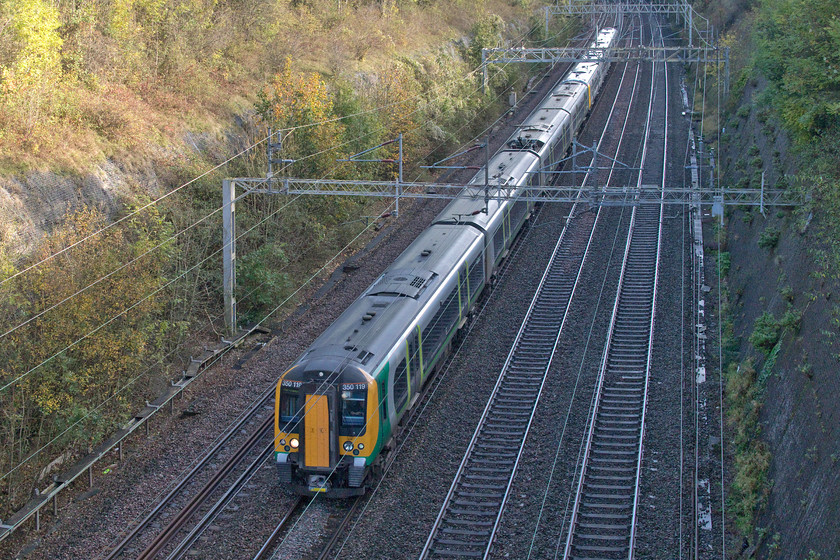 350119 & 350104, LN unidentified down working, Roade cutting 
 I noticed on RTT that all London Northwestern services were carrying strange headcodes such as 2Z51. I could not work out why but then realised that all was not well with local services. In fact, there were no trains running on the up and down slow lines out of London due to, what I discovered later to be, a massive signalling failure at Euston. This also affected Virgin services causing many cancellations and hours of delays. 350119 and 350104 forms and empty coaching stock working from somewhere south that would then work a scratch service for beleaguered passengers waiting at Northampton. 
 Keywords: 350119 350104 unidentified down working Roade cutting