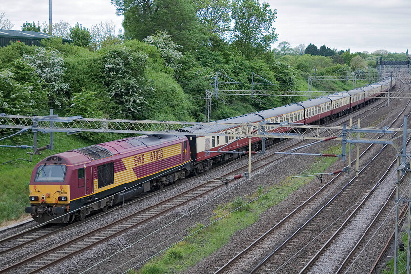 67028, outward leg of The Lakelander, 07.06 London Euston-Carlisle (1Z62), Victoria bridge 
 UK Railtours' Lakelander charter approaches Roade on the down fast line, meaning that it will avoid Northampton, with 67028 on the rear. The 07.06 Euston to Carlisle 1Z62 was being led by 90026, also an EWS machine that almost matches the rake of uniform Mk. 1s. Things went to planned all day for the passengers board with them even enjoying an early arrival back into Euston! 
 Keywords: 67028 The Lakelander 07.06 London Euston-Carlisle 1Z62 Victoria bridge UK Railtours