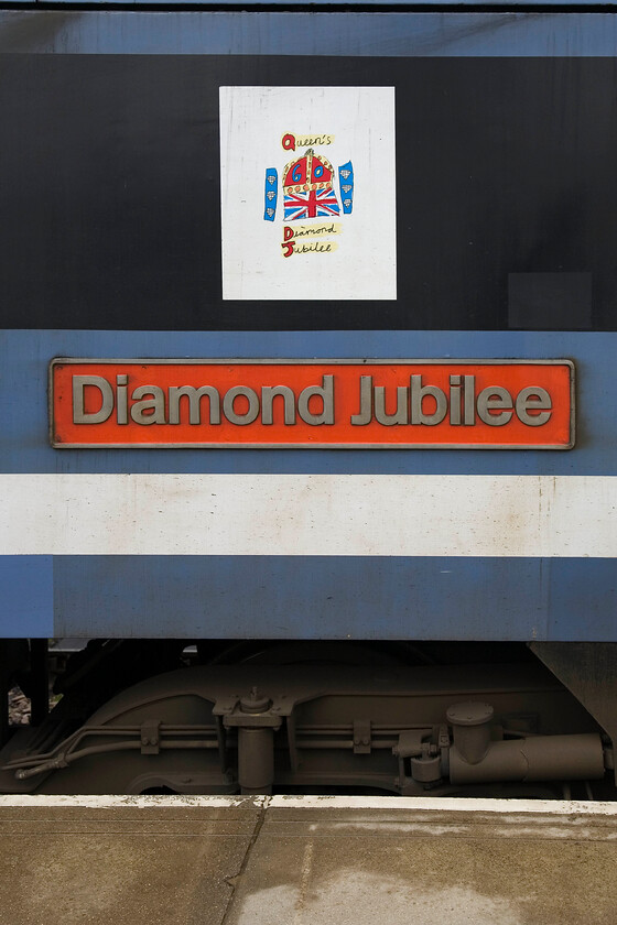 Nameplate & vinyl, 90009, LE 11.00 Norwich-London Liverpool Street, Norwich station 
 The nameplate of 90009 'Diamond Jubilee' as it waits at Norwich to lead the 11.00 service to London Liverpool Street. Whilst the plate is a traditional one seen on many locomotives, I am not at all sure about the odd vinyl attached above it! The locomotive was named nearly eighteen months ago in May 1012. 
 Keywords: Nameplate vinyl 90009 11.00 Norwich-London Liverpool Street Norwich station Diamond Jubilee