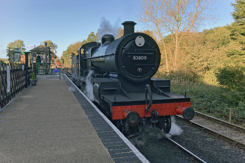 53809, running round, Holt station-14.10.23 
 My wife suggested that we call in at Holt station on our journey as we were passing. In doing so we were just in time to see the North Norfolk Railway's final train of the day, the 16.10 service to Sheringham. Just prior to its departure former Somerset and Dorset's 1925 built 7F 53809 reverses slowly on to its stock. It will then run tender first to Sheringham. Unfortunately, by this stage in October, the sun has dropped a little low in the sky behind some tall trees at Holt station meaning that it's in shadow. Also, this image is captured on my rather old iPhone. 
 Keywords: 53809 running round Holt station 14.10.23