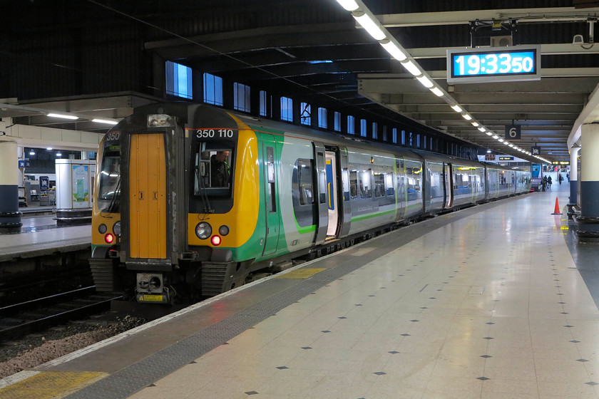 350110, 19.49 London Euston-Birmingham New Street (2K13, 2L), London Euston station 
 Our train back home to Northampton sits at Euston's platform 6 ready work the 19.49 to Birmingham New Street. The cheapest advanced ticket for this service at the time of booking was first class! This reinforces that the fare structure on the national network is in dire need of the major reorganisation as keeps being talked about. 
 Keywords: 350110 2K13 London Euston station