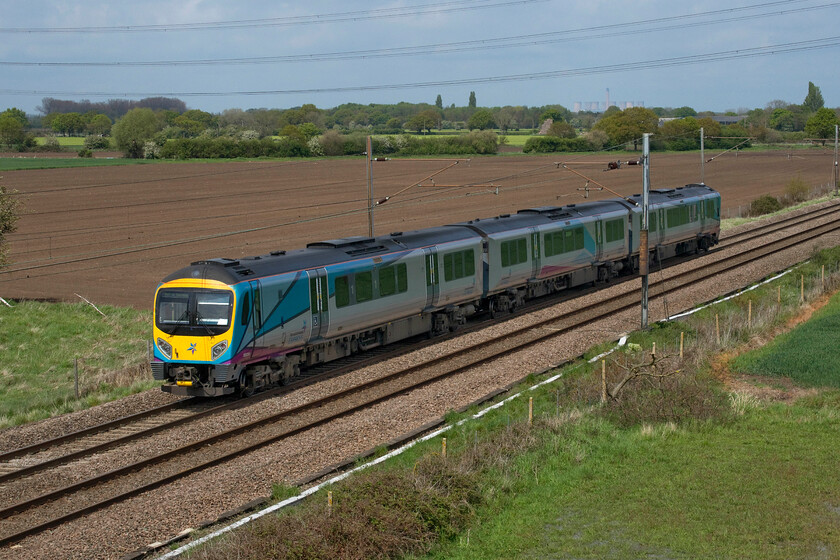 185124, TP 13.40 Doncaster-York Siemens (5D98, RT), Joan Croft Junction 
 TransPennine Express' 185124 passes Joan Croft Junction working the 13.40 Doncaster to York Siemens empty stock move. I suspect that the unit was heading to the York depot for maintenance or an exam. of some kind. Standing in a slightly more elevated position on the new bridge's embankment than in the last photograph enables a South Yorkshire landmark to be seen on the skyline in the form of the closed Eggborough power station. Its six cooling towers no longer emit steam into the skyscape as it closed in March 2018 but as yet it has not been demolished unlike its near neighbour Ferrybridge that was razed to the ground in 2019, see..... https://www.youtube.com/watch?v=xGk5nq5htPk 
 Keywords: 185124 TP 13.40 Doncaster-York Siemens 5D98 Joan Croft Junction TPE TransPennine Express