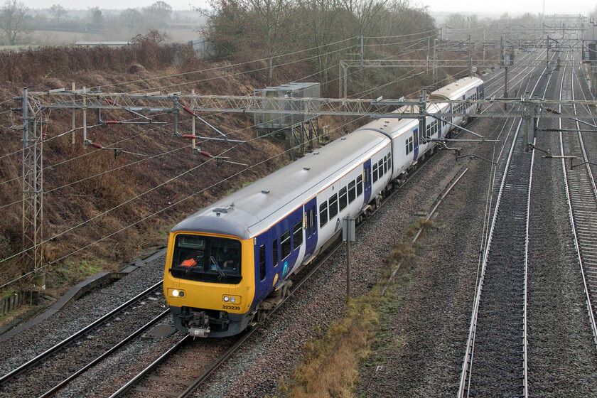 323239, 11.46 Wolverton Works-Allerton Depot (5Q36, 29E), Victoria bridge 
 One of just seventeen Class 323 units operated by Northern, 323239 is seen just a short distance into its return journey home to Allerton Depot. The unit had spent a short time at Wolverton works before returning as today's 5Q36 11.46 Wolverton to Allerton. With no incoming balancing working, I suspect that the driver would have travelled to Wolverton on the cushions earlier in the morning. 
 Keywords: 323239 11.46 Wolverton Works-Allerton Depot 5Q36 Victoria bridge Northern