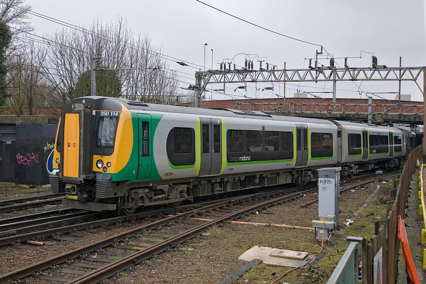 350114, LM 07.54 Birmingham New Street-London Euston, Northampton station car park (Charlie & Scouts on-board) 
 350114 leaves Northampton working the London Midland 07.54 Birmingham New Street to Euston service. My son and members of his Scout troop were on board this train making their way to London for their annual 'big day' out. 
 Keywords: 350114 07.54 Birmingham New Street-London Euston Northampton station car park London Midland Desiro