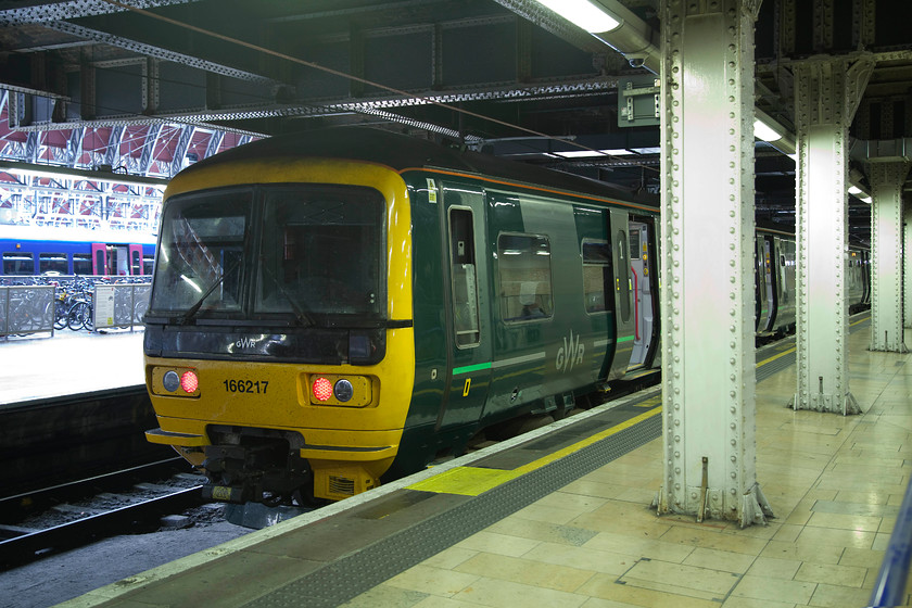 166217, GW 17.37 Oxford-London Paddington (2P76, 1L), London Paddington station 
 Not a great picture, but one following my policy of photographing all trains that I travel on. 166217 stands at Paddington having worked the 17.37 from Oxford, Andy and I took this train from Tilehurst and it must rank as one of the hottest and most uncomfortable train journeys that I've ever taken barring when I travelled in India! 
 Keywords: 166217 2P76 London Paddington station