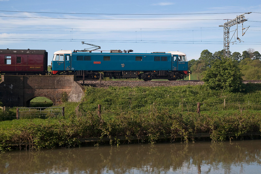 86259, outward leg of The Cumbrian Mountain Express, 07.10 London Euston-Carlisle (1Z86), Bugbrooke SP679564 
 A side on view of 86259 with its 'Peter Pan' nameplates (the other side it's Les Ross) passing near to Bugbrooke in Northamptonshire with the outward leg of the 1Z86 Cumbrian Mountain Express. The canal in the foreground is the Grand Union that, like the line behind, links London to Birmingham by very similar routes! 
 Keywords: 86259 The Cumbrian Mountain Express 07.10 London Euston-Carlisle 1Z86 Bugbrooke SP679564