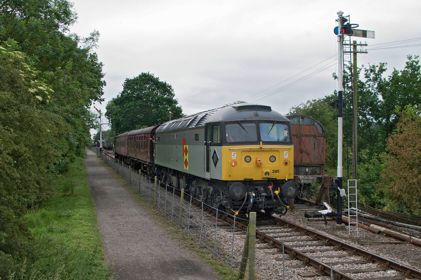 47395, 13.30 Pitsford return, Bridge 13 
 Working the 13.00 return working 47395 pushes the train back towards Pitsford and Brampton station. The train has just crossed the fabled bridge thirteen that was a major project for the railway to completely rebuild. Costing 50 000 the bridge was reopened in 2002 enabling a considerable extension to the north with just another fourteen miles or so to get to Market Harborough! 
 Keywords: 47395 13.30 Pitsford return Bridge 13 NLR Northampton and Lamport Railway