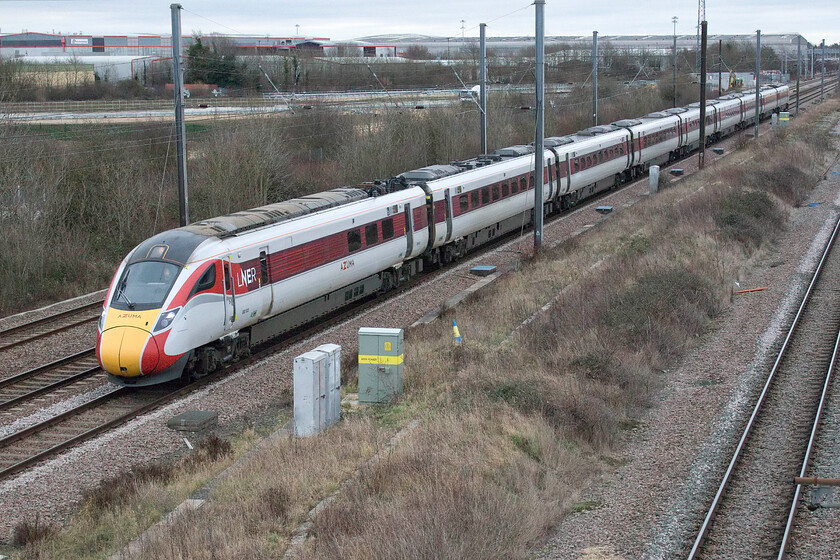 800103, GR 10.00 London King's Cross-Aberdeen (1W11, 1L), Marholm TF154036 
 With evidence of the Werrington-dive under in the background 800103 heads north past Marholm working the 10.00 King's Cross to Aberdeen LNER service. Notice the driver waving that was also accompanied by a blast on the horn acknowledging a small family group standing on the bridge doing what family groups have done for years, cheering the passing of trains! 
 Keywords: 800103 10.00 London King's Cross-Aberdeen 1W11 Marholm TF154036 Azuma LNER