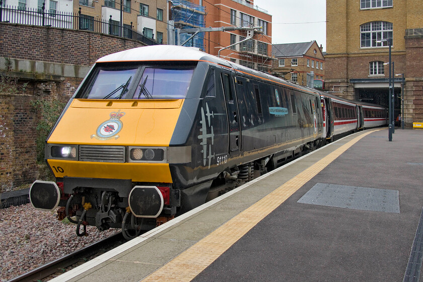 91110, GR 17.03 London King's Cross-Leeds (1D23, 14L), London King's Cross station 
 Still looking superb in its one-off livery, 91110 Battle of Britain Memorial Flight waits at Kings Cross platform zero to leave with the 17.03 service to Leeds. I do not know how long the Class 91s will remain in service on the ECML but having been in operation for twenty-five years they have outlived the Deltics by a decade now. 
 Keywords: 91110 17.03 London King's Cross-Leeds 1D23 London King's Cross station LNER IC225 Battle of Britain Memorial Flight